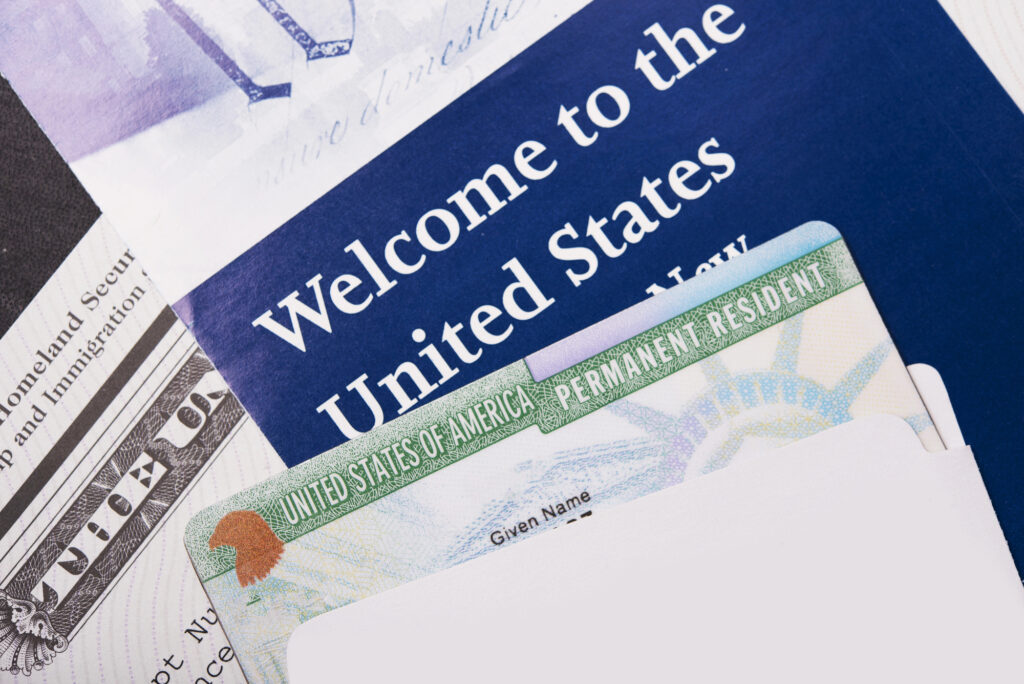 Closeup of a US visa and welcome pamphlets